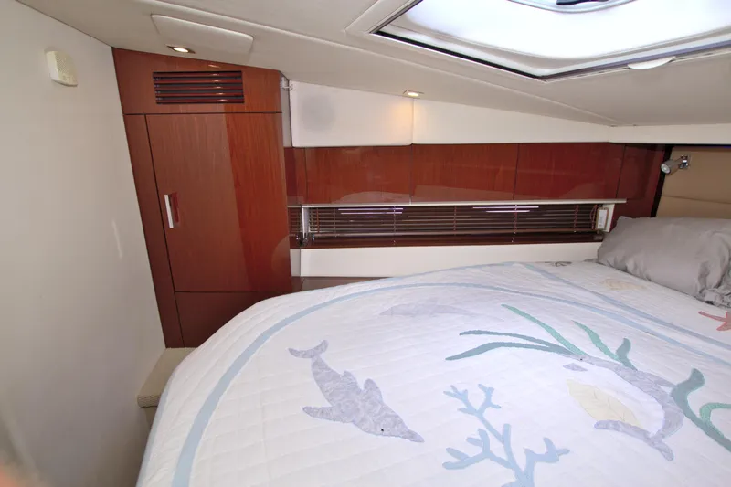 Slide: The Image of Luxurious cabin interior of 2013 Sea Ray 450 Sundancer yacht with elegant wood finishes. - 38