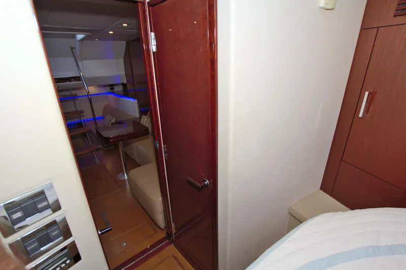 Slide: The Image of Interior view of 2013 Sea Ray 450 Sundancer yacht, featuring modern seating and ambient lighting. - 39