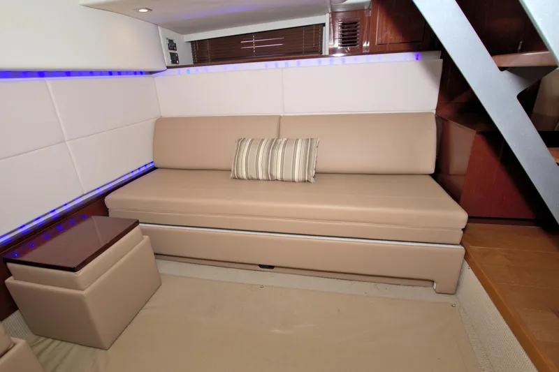 Slide: The Image of Interior of 2013 Sea Ray 450 Sundancer yacht with beige seating and modern design. - 43
