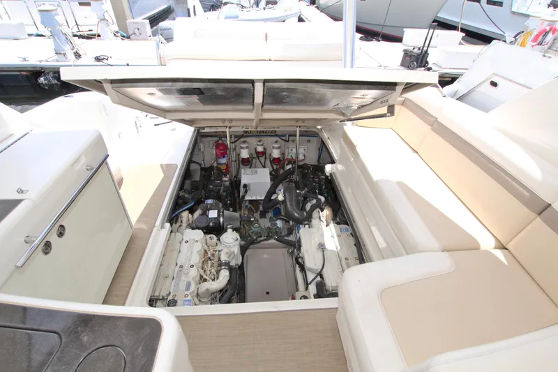 Slide: The Image of Engine compartment of a 2013 Sea Ray 450 Sundancer yacht, showcasing mechanical components. - 45