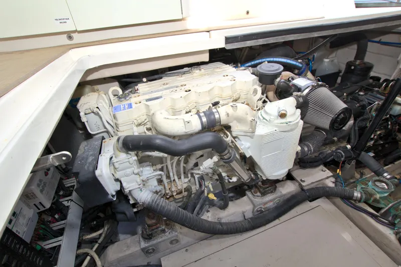 Slide: The Image of Engine compartment of a 2013 Sea Ray 450 Sundancer boat, showcasing mechanical components. - 47