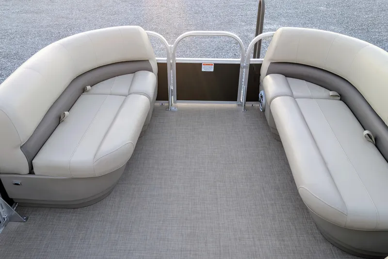 Slide: The Image of 2025 Sun Tracker Party Barge 16 DLX interior with beige seating and spacious layout. - 5