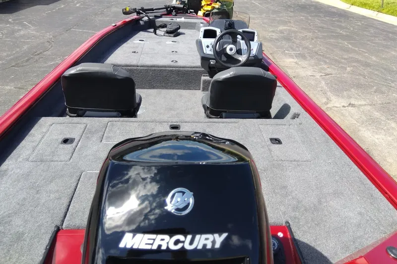 Slide: The Image of 2025 Tracker Pro Team 175 Crappie Edition boat with Mercury engine, red and gray interior. - 5