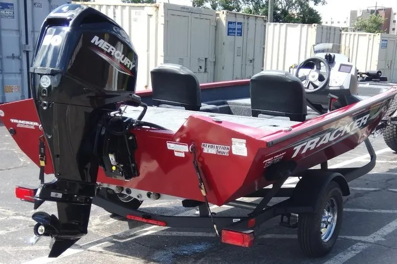 Slide: The Image of 2025 Tracker Pro Team 175 Crappie Edition boat with Mercury engine, parked outdoors. - 6