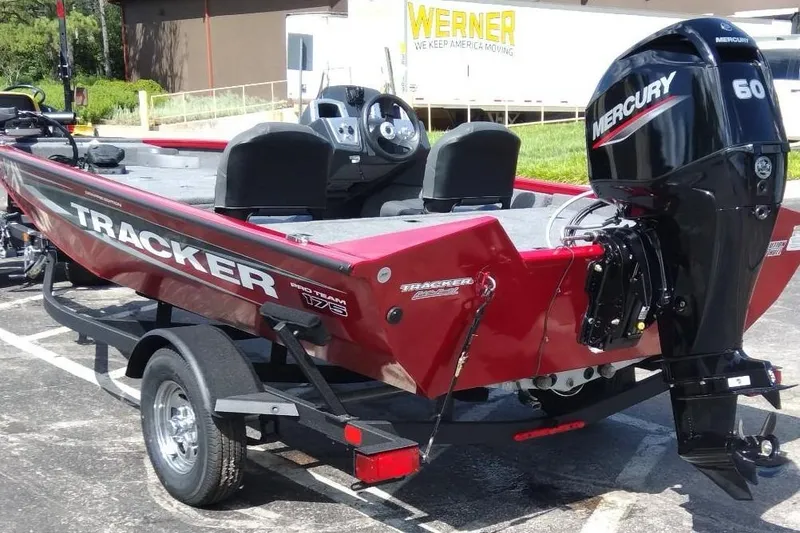 Slide: The Image of 2025 Tracker Pro Team 175 Crappie Edition boat with Mercury 60 engine, parked outdoors. - 7
