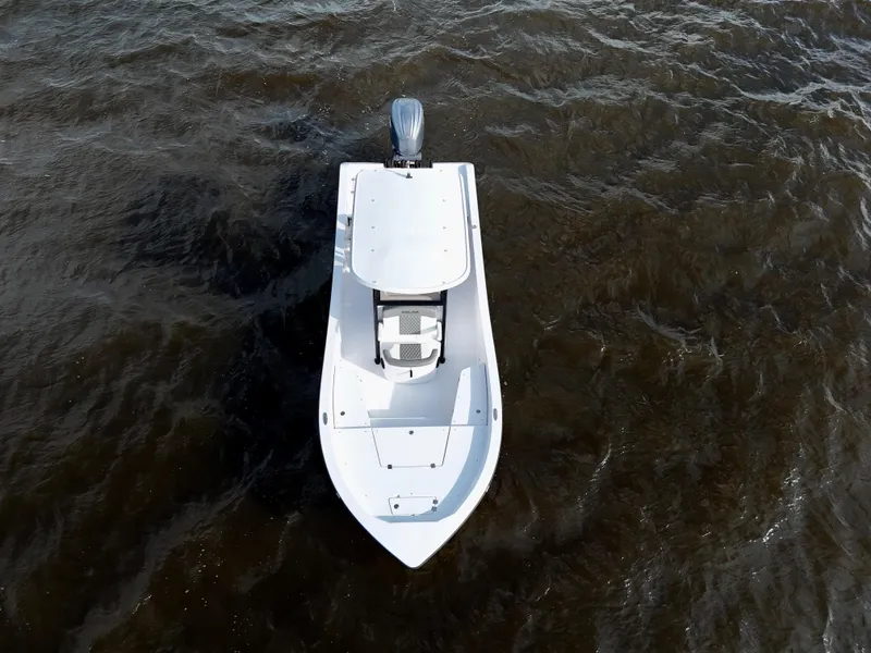 Slide: The Image of 2025 Action Craft 24 Coastal Bay boat on water, aerial view. - 23
