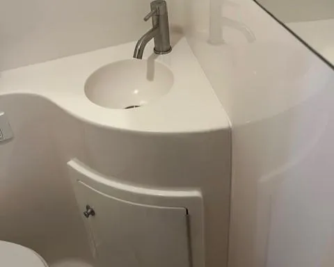 Slide: The Image of 2020 Regal 26 XO boat bathroom with modern sink and faucet. - 10