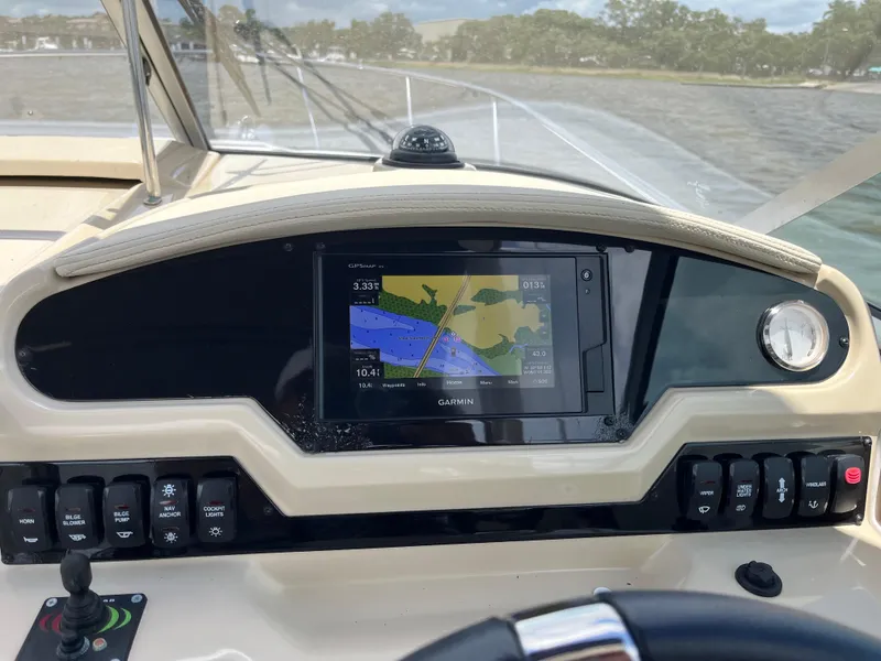 Slide: The Image of Dashboard of a 2020 Regal 26 XO boat with Garmin navigation system. - 16