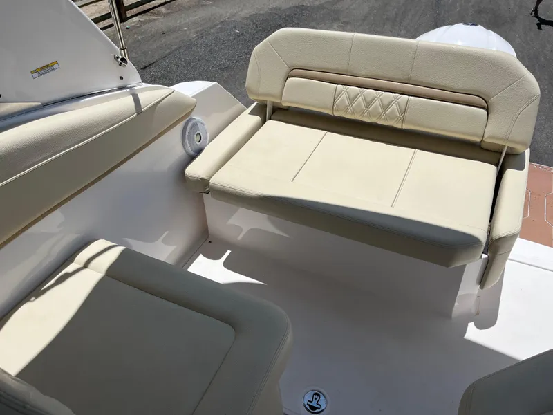 Slide: The Image of 2020 Regal 26 XO boat interior with beige seating and elegant design. - 20