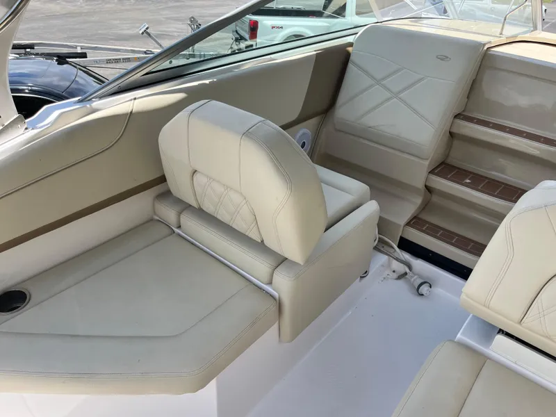 Slide: The Image of 2020 Regal 26 XO boat interior with beige seating and steps. - 22