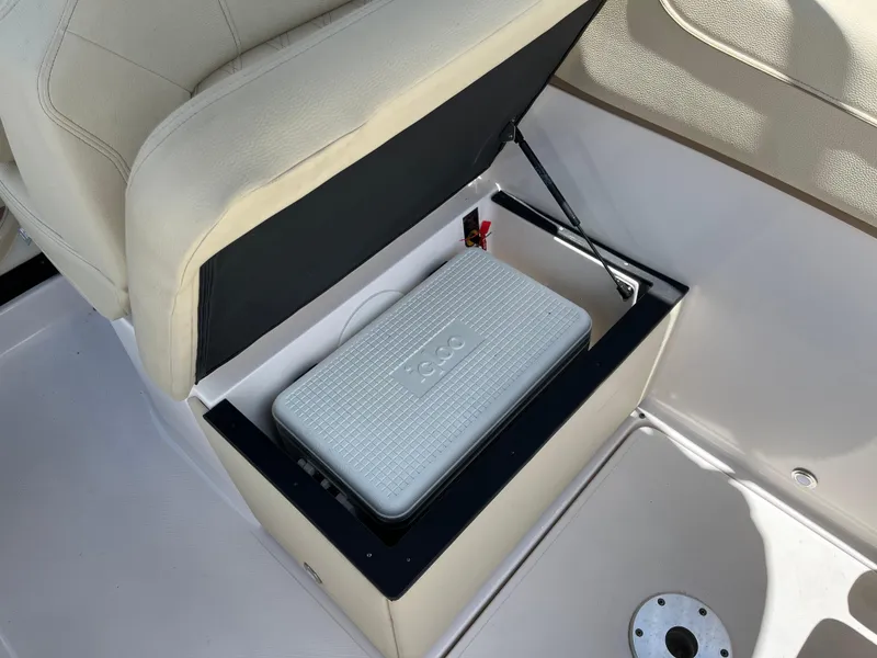 Slide: The Image of 2020 Regal 26 XO boat storage compartment with cooler under seat. - 25