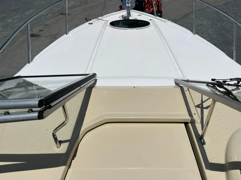 Slide: The Image of 2020 Regal 26 XO boat deck with open windshield and hatch. - 29