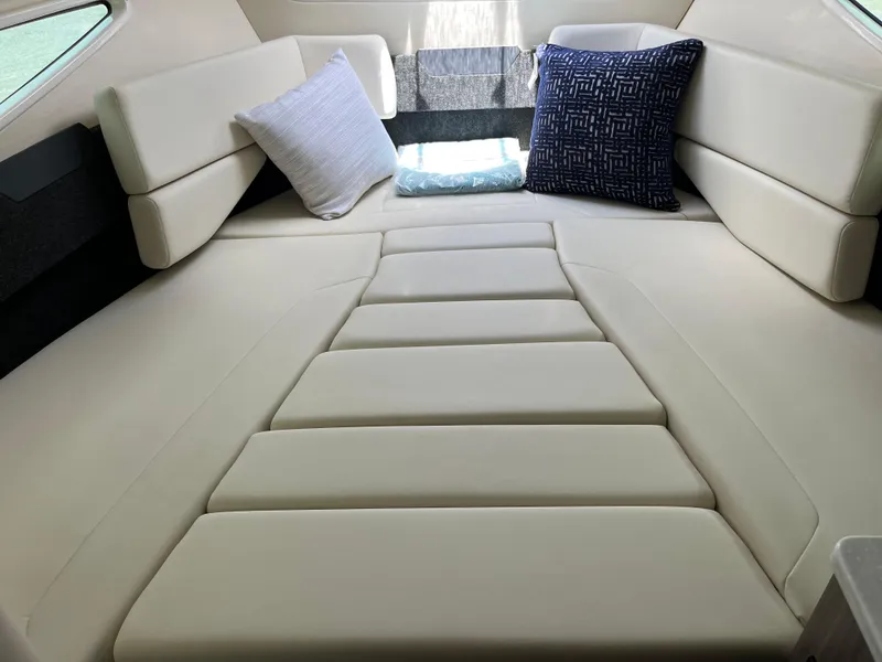 Slide: The Image of Luxurious interior cabin of 2020 Regal 26 XO boat with plush seating and cushions. - 33