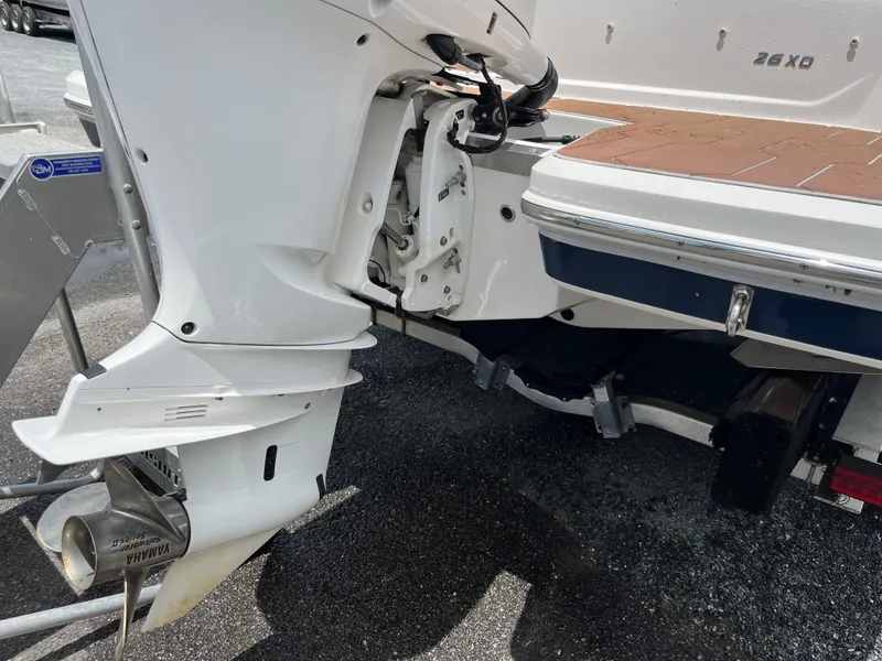 Slide: The Image of 2020 Regal 26 XO boat stern with Yamaha outboard motor on a trailer. - 39