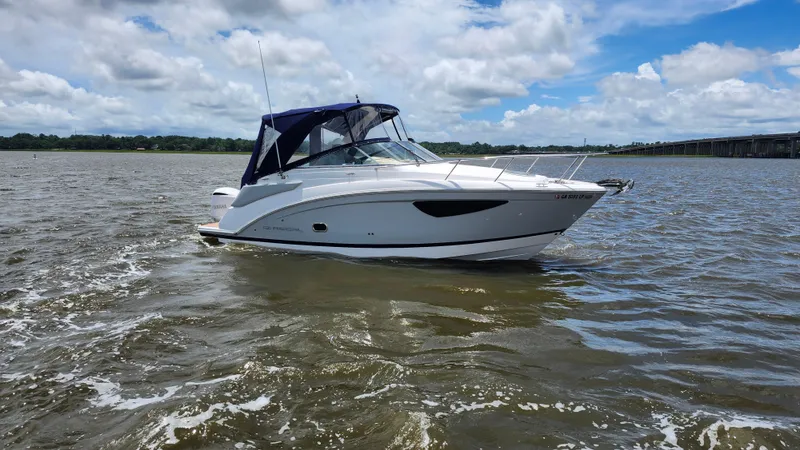 Slide: The Image of 2020 Regal 26 XO boat on open water under a partly cloudy sky. - 42