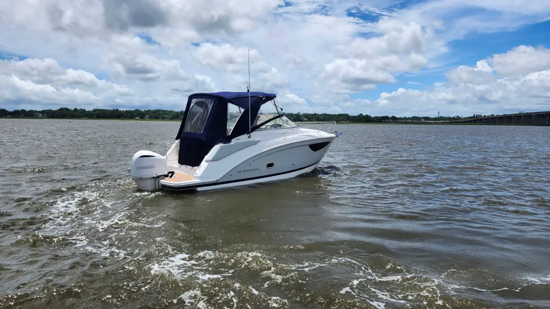 Slide: The Image of 2020 Regal 26 XO boat on open water under a partly cloudy sky. - 43