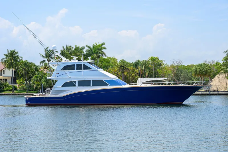 The Image of Luxury 2004 Sea Force IX 82 Enclosed Bridge yacht on tranquil water. - 0