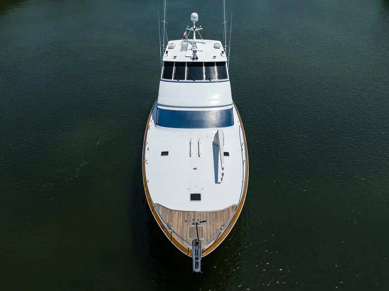 Slide: The Image of 2004 Sea Force IX 82 Enclosed Bridge yacht on calm water, aerial view. - 10