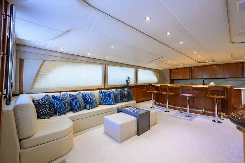 Slide: The Image of Luxurious interior of 2004 Sea Force IX 82 Enclosed Bridge yacht with elegant seating and bar area. - 19