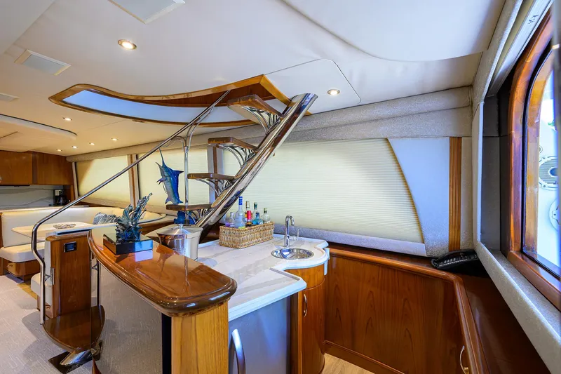 Slide: The Image of Luxurious interior of 2004 Sea Force IX 82 Enclosed Bridge yacht with elegant wood finishes. - 22
