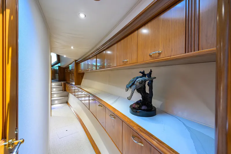Slide: The Image of Luxurious interior of 2004 Sea Force IX 82 Enclosed Bridge yacht with elegant wood cabinetry. - 30