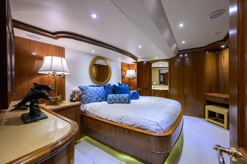 Slide: The Image of Luxurious bedroom on 2004 Sea Force IX 82 Enclosed Bridge yacht with elegant wood finishes. - 31