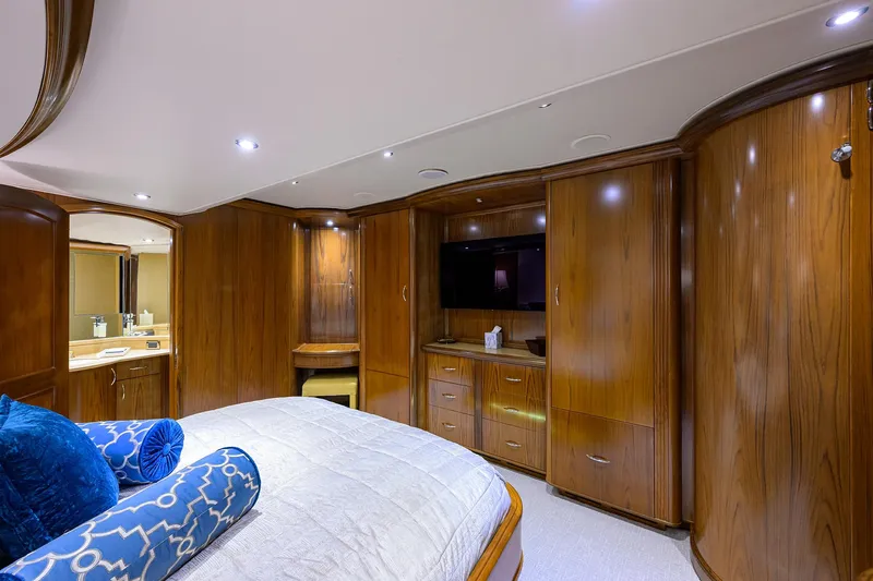 Slide: The Image of Luxurious cabin interior of 2004 Sea Force IX 82 Enclosed Bridge yacht with wood paneling. - 32