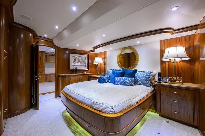 Slide: The Image of Luxurious bedroom interior of 2004 Sea Force IX 82 Enclosed Bridge yacht, featuring elegant wood finishes. - 33