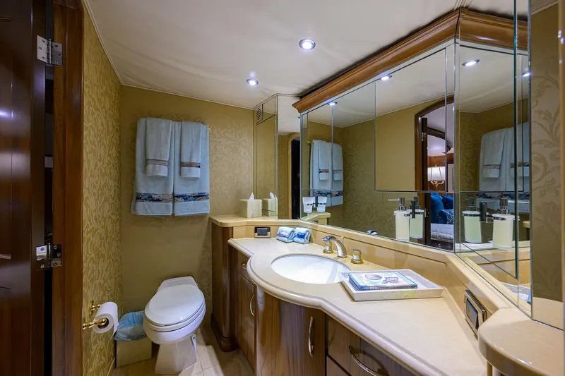 Slide: The Image of Luxurious bathroom in 2004 Sea Force IX 82 Enclosed Bridge yacht, featuring elegant fixtures and mirrors. - 37