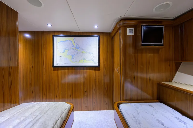 Slide: The Image of Luxurious cabin interior of 2004 Sea Force IX 82 Enclosed Bridge yacht with wood paneling. - 47