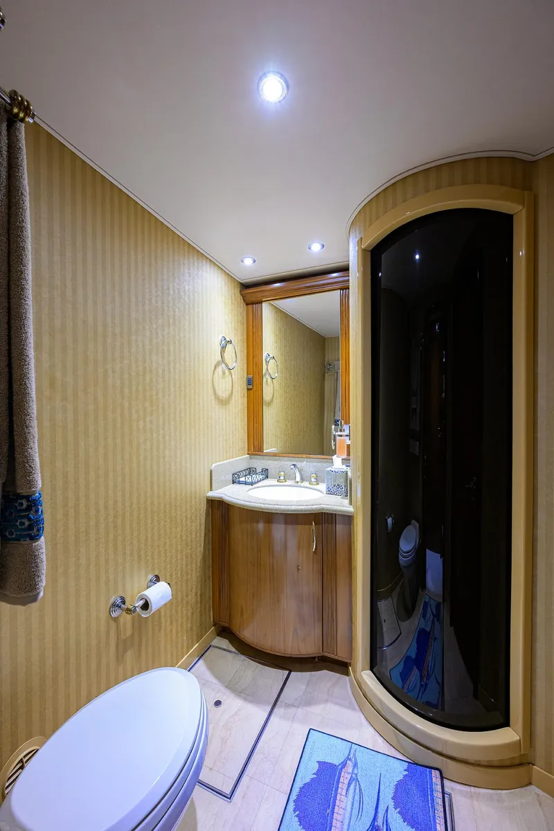 Slide: The Image of Luxurious bathroom in 2004 Sea Force IX 82 Enclosed Bridge yacht, featuring modern fixtures and elegant design. - 48
