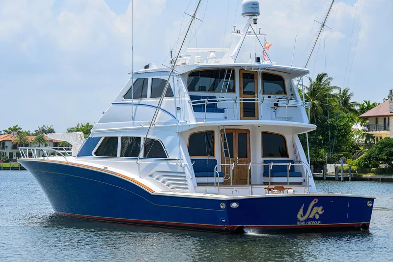 Slide: The Image of 2004 Sea Force IX 82 Enclosed Bridge yacht on calm water, showcasing luxury design. - 6