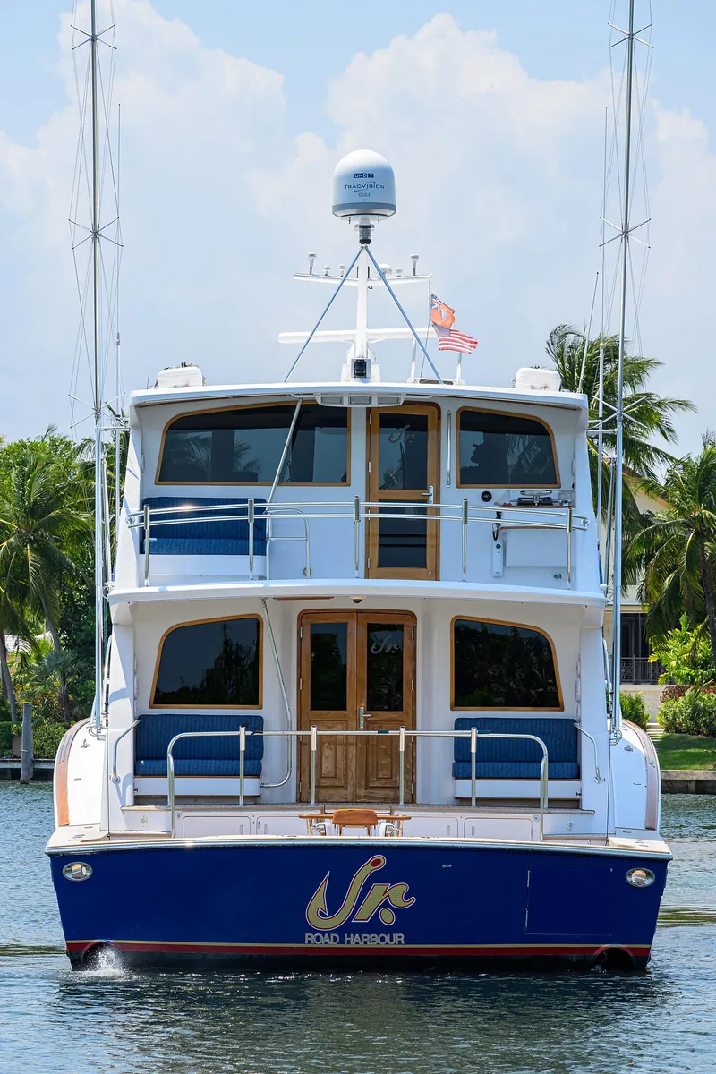 Slide: The Image of 2004 Sea Force IX 82 Enclosed Bridge yacht on water, rear view. - 7