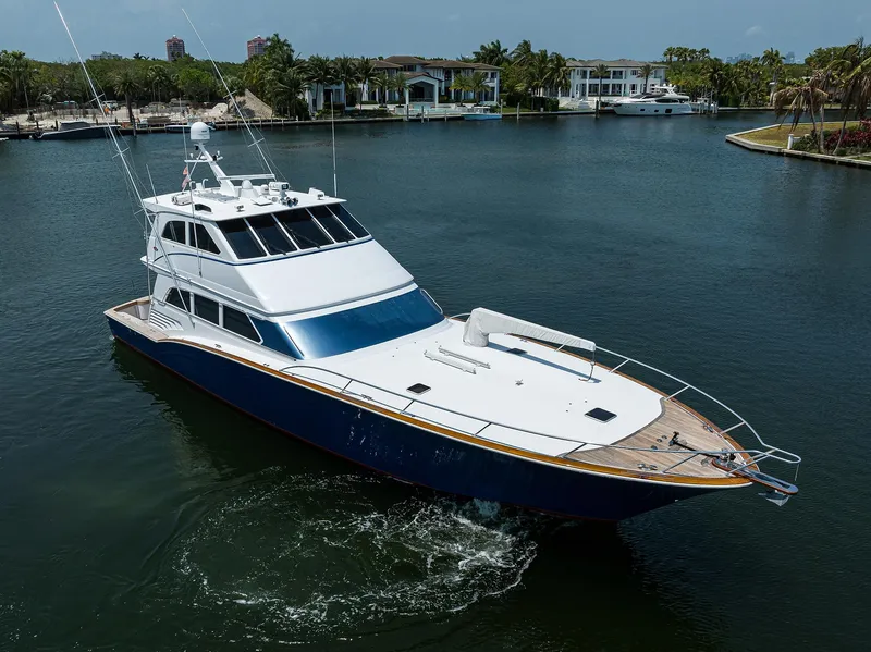 Slide: The Image of 2004 Sea Force IX 82 Enclosed Bridge yacht cruising in a serene marina. - 9