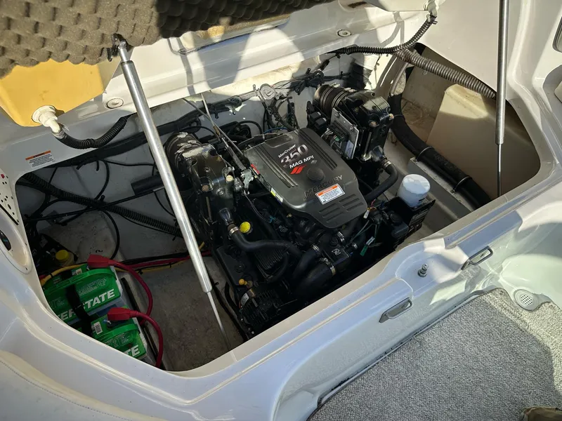 Slide: The Image of Engine compartment of a 2006 Crownline 270 BR boat, featuring a MerCruiser engine. - 11