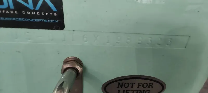 Slide: The Image of 2023 Regulator 26XO boat hull identification number with "Not for Lifting" sticker. - 40