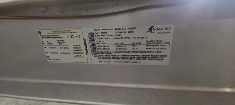 Slide: The Image of Label on 2023 Regulator 26XO boat trailer, displaying specifications and manufacturer details. - 41