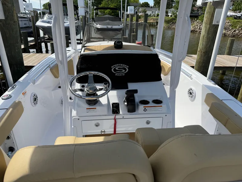 Slide: The Image of 2023 Sportsman Open 232 Center Console boat interior with steering wheel and seating. - 10