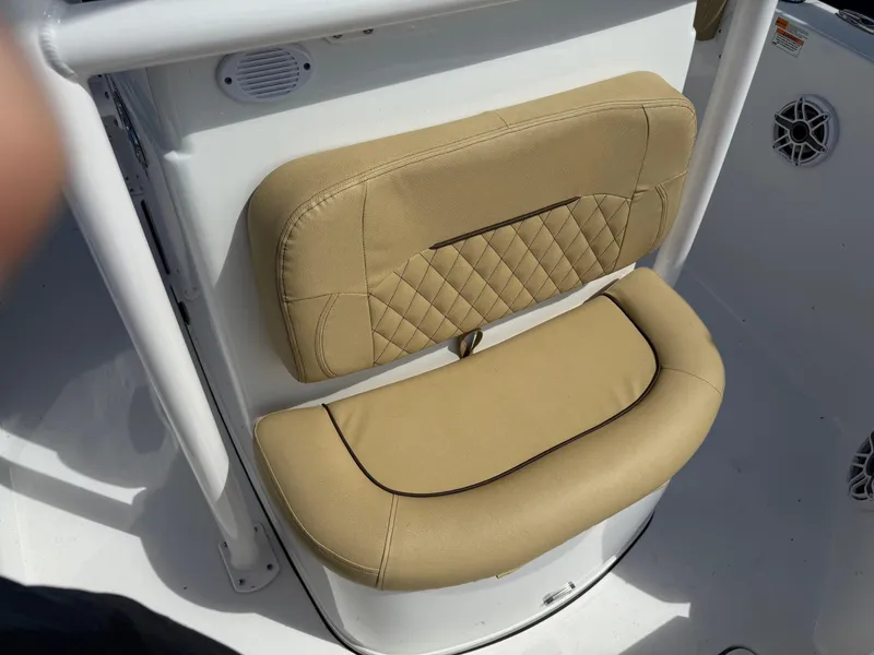 Slide: The Image of 2023 Sportsman Open 232 Center Console boat seat with beige upholstery. - 13