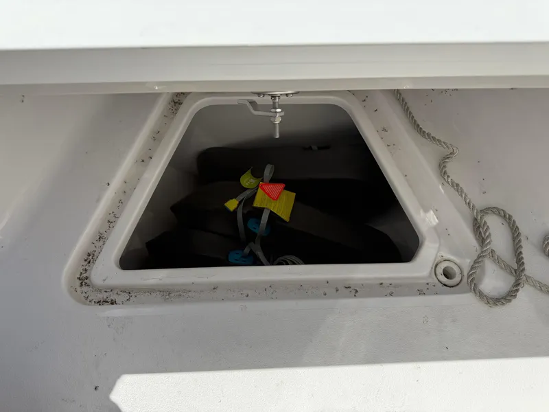 Slide: The Image of Storage compartment on a 2023 Sportsman Open 232 Center Console boat. - 17