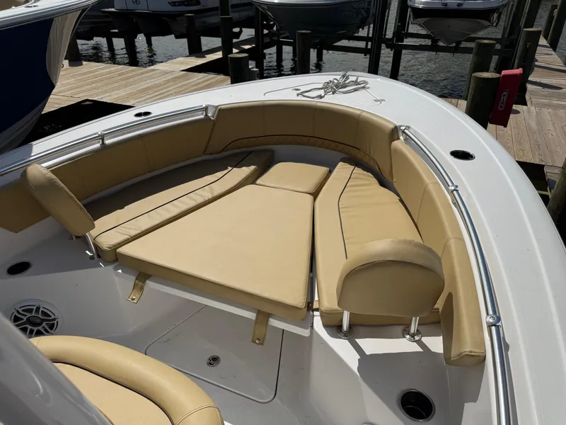 Slide: The Image of 2023 Sportsman Open 232 Center Console boat with tan seating and deck view. - 18