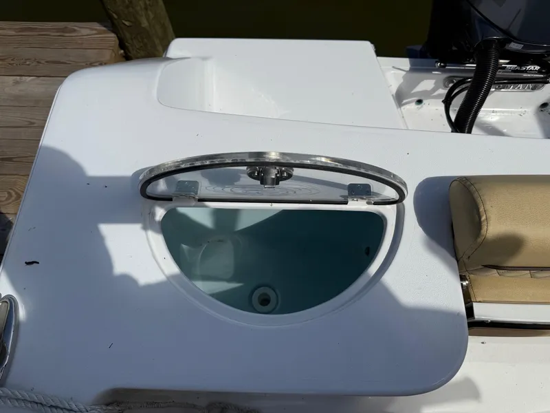 Slide: The Image of 2023 Sportsman Open 232 Center Console boat with open storage compartment. - 7