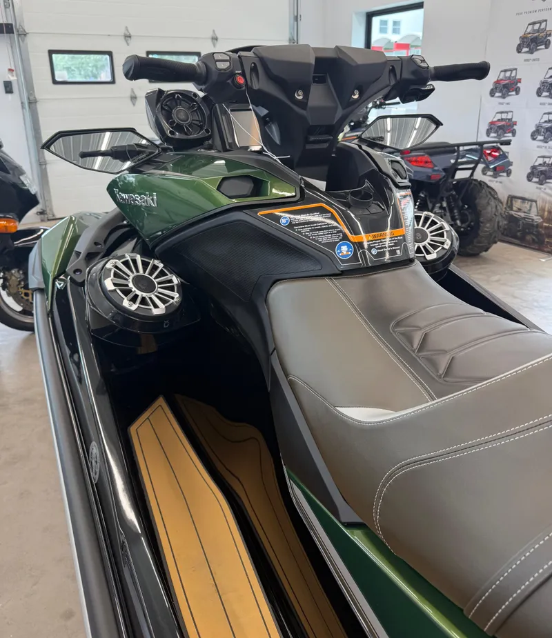 Slide: The Image of 2025 Kawasaki Jetski Ultra 310LX in showroom, featuring sleek design and advanced controls. - 4