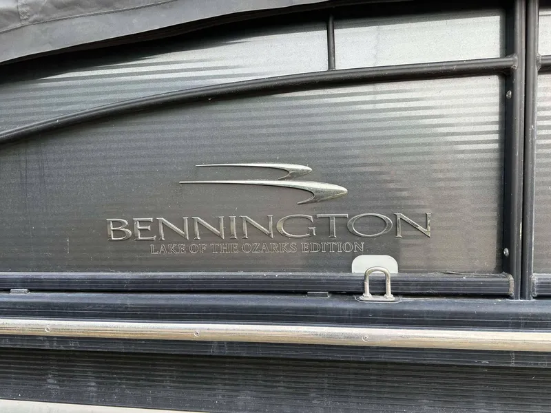 Slide: The Image of 2016 Bennington 2875 QCW I/O, Lake of the Ozarks Edition logo on boat exterior. - 14