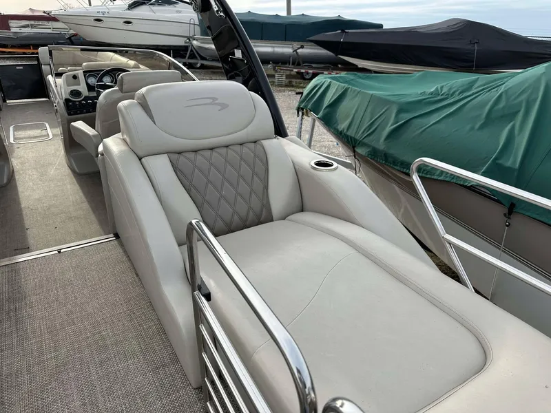 Slide: The Image of 2016 Bennington 2875 QCW I/O boat with luxurious seating and sleek design. - 15