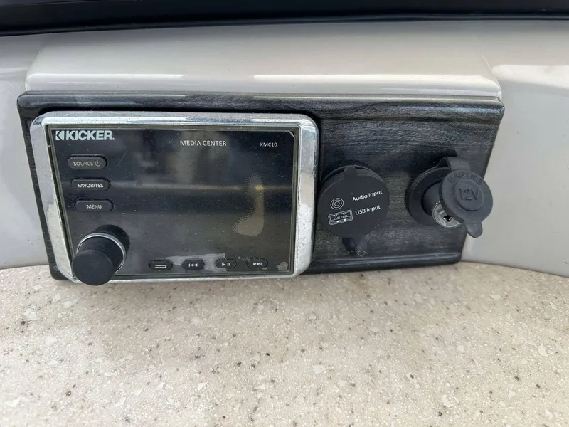 Slide: The Image of Kicker media center on 2016 Bennington 2875 QCW I/O boat dashboard. - 21