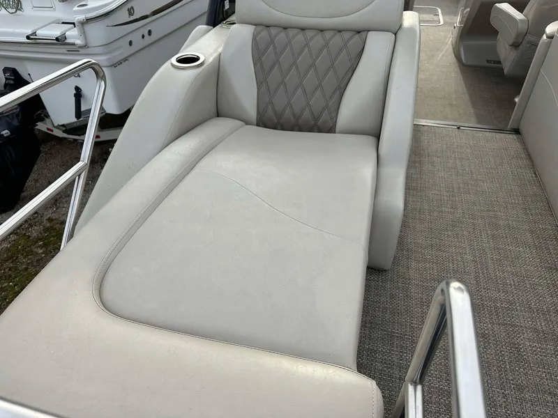 Slide: The Image of Luxurious seating on a 2016 Bennington 2875 QCW I/O boat with diamond-patterned upholstery. - 22