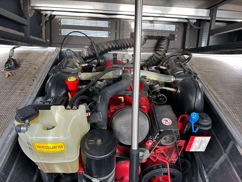 Slide: The Image of Engine compartment of a 2016 Bennington 2875 QCW I/O boat, showcasing mechanical components. - 29