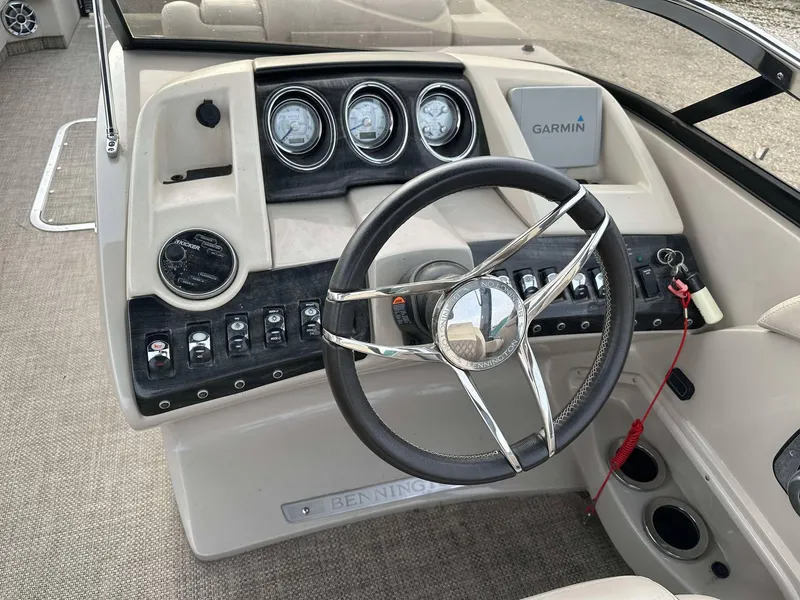 Slide: The Image of Steering console of a 2016 Bennington 2875 QCW I/O boat with Garmin navigation system. - 3