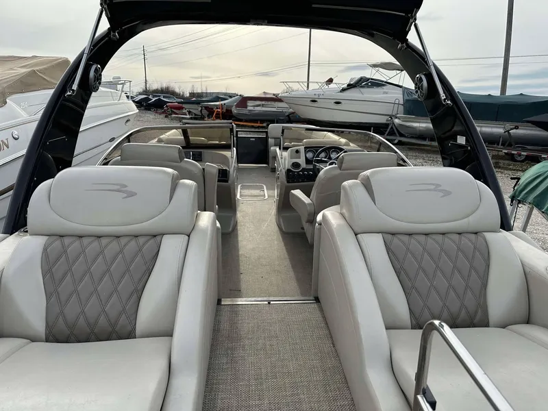 Slide: The Image of 2016 Bennington 2875 QCW I/O boat interior with luxurious seating and modern design. - 30